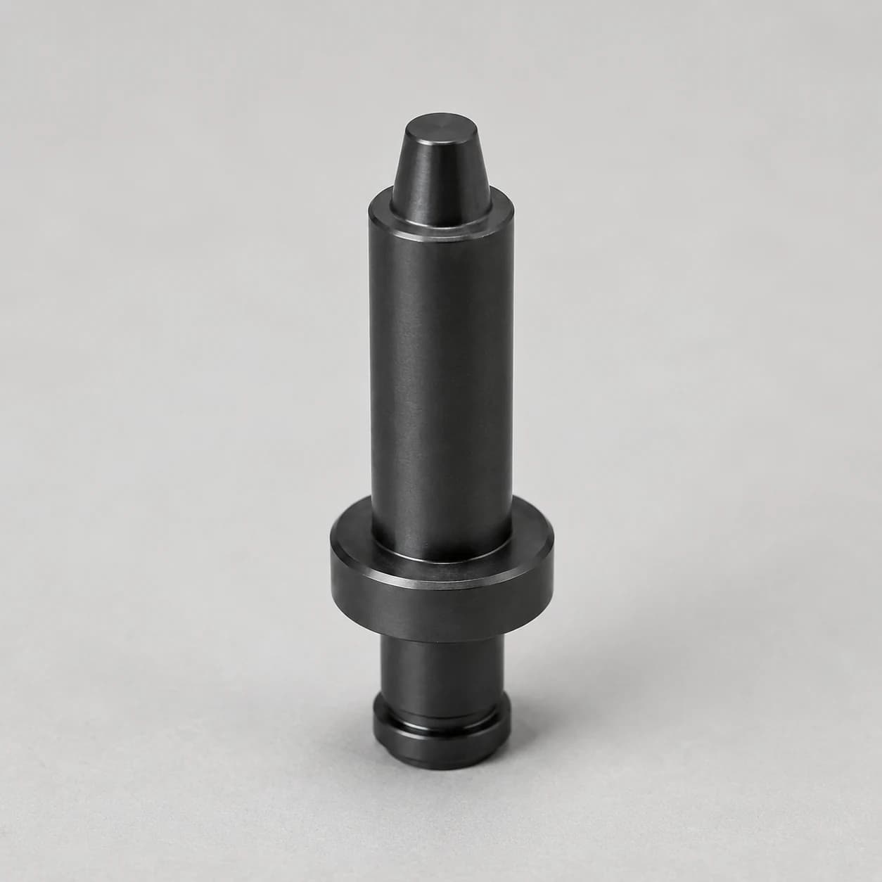 Silicon nitride positioning pin with stepped body, shoulder and tapered locating tip