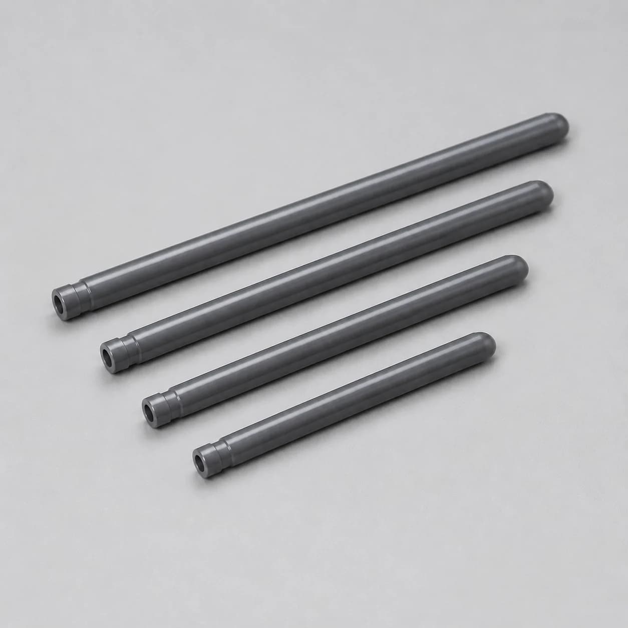 Four silicon nitride thermocouple protection tubes in different lengths