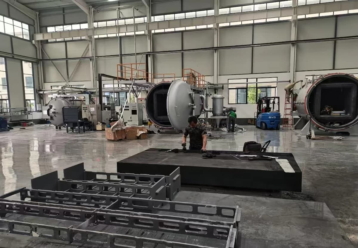 Sintering workshop with furnaces, work areas and loading fixtures
