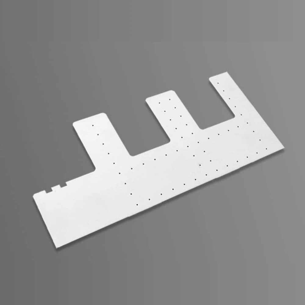 Machined alumina ceramic carrier with holes and cut-outs