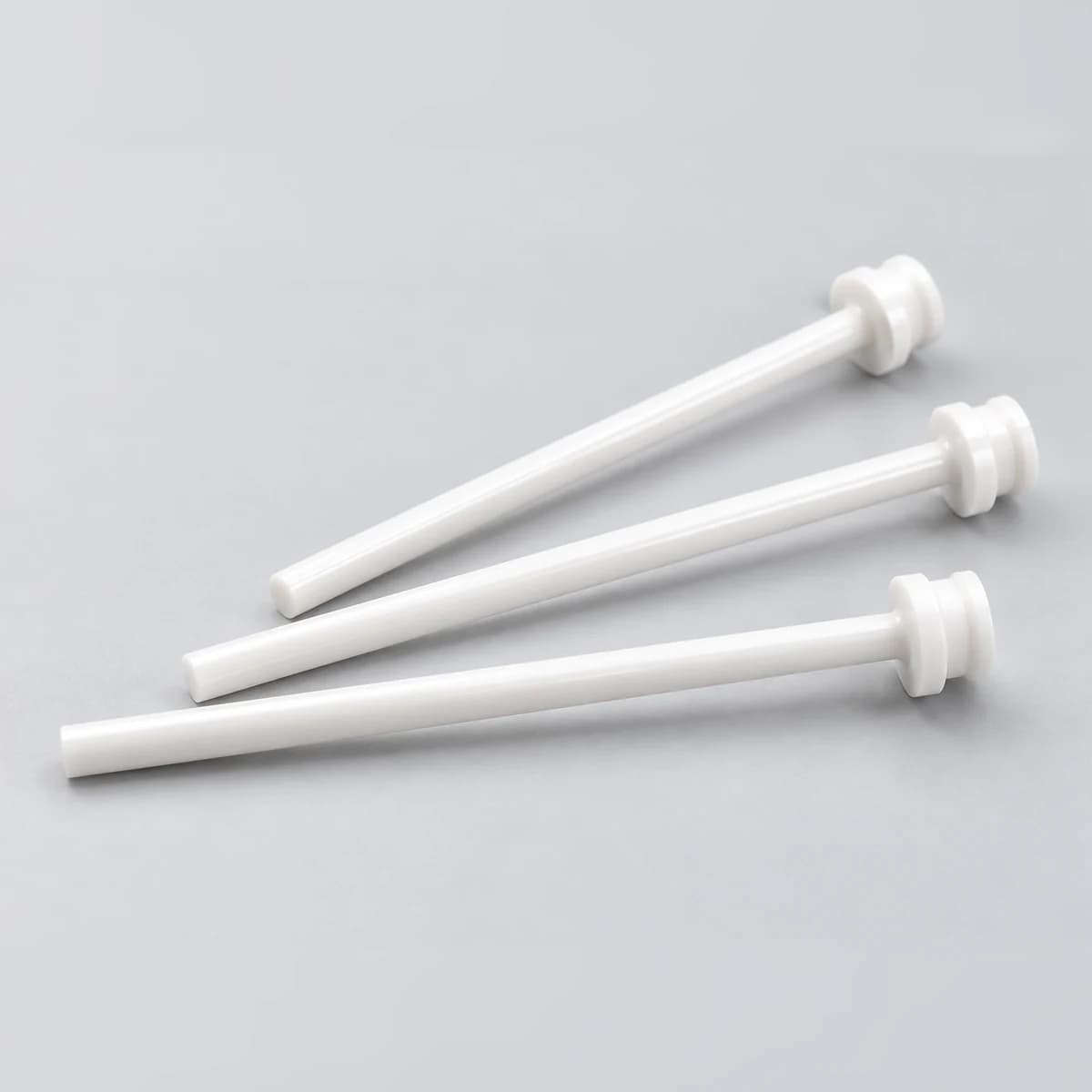 Three precision white zirconia ceramic shafts