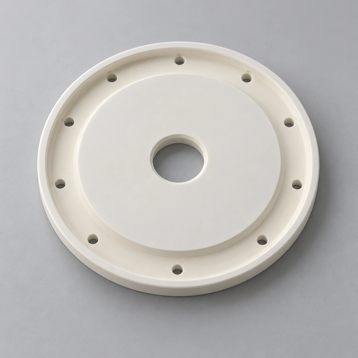 AI-generated concept of a stepped alumina disc with ten outer holes and a central bore