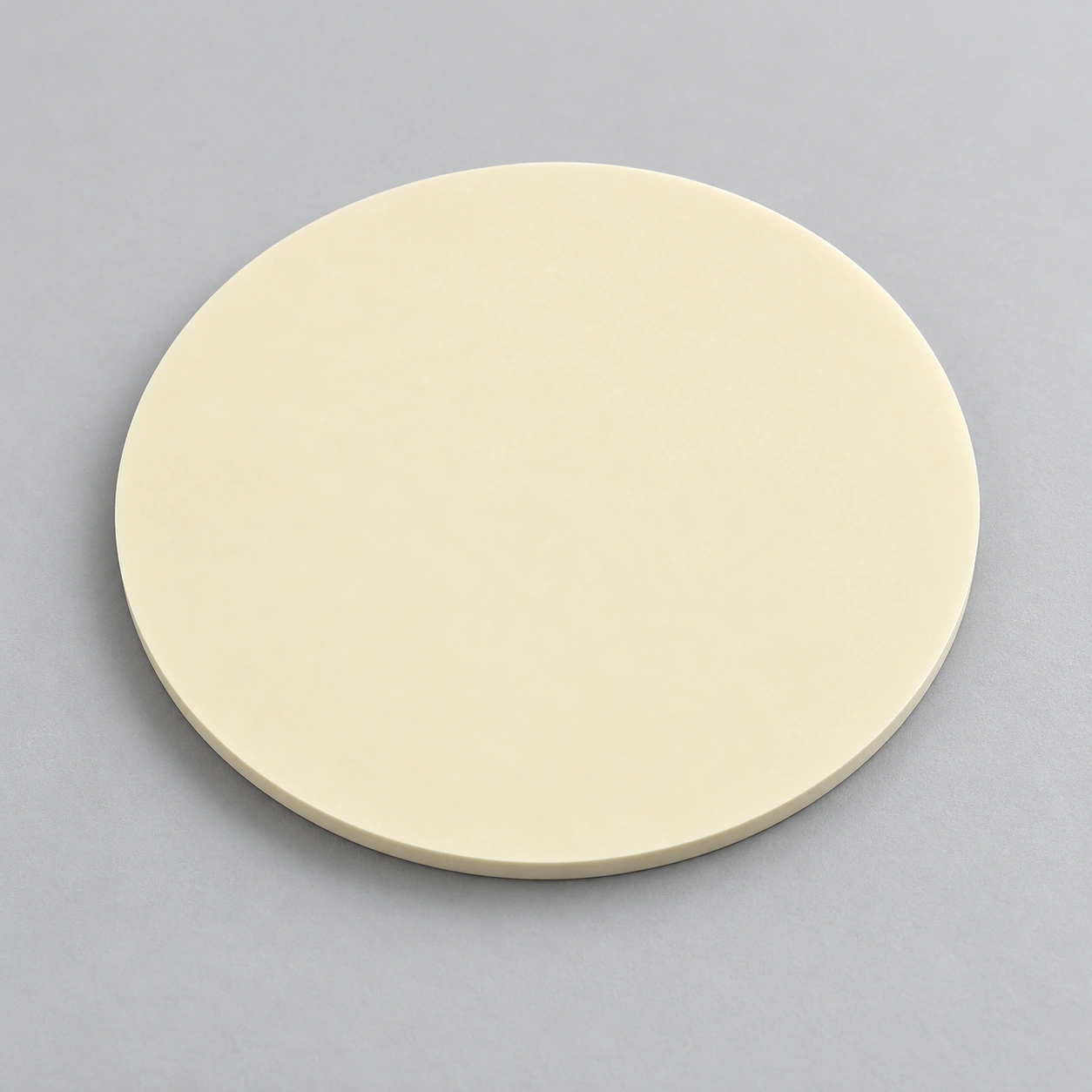 AI-generated concept of a slim plain alumina circular blank with a visible edge