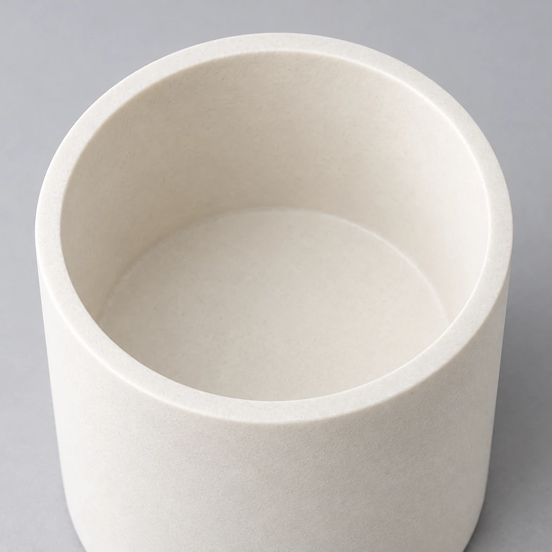 Independent conceptual close-up of an alumina crucible rim, inner wall and bottom