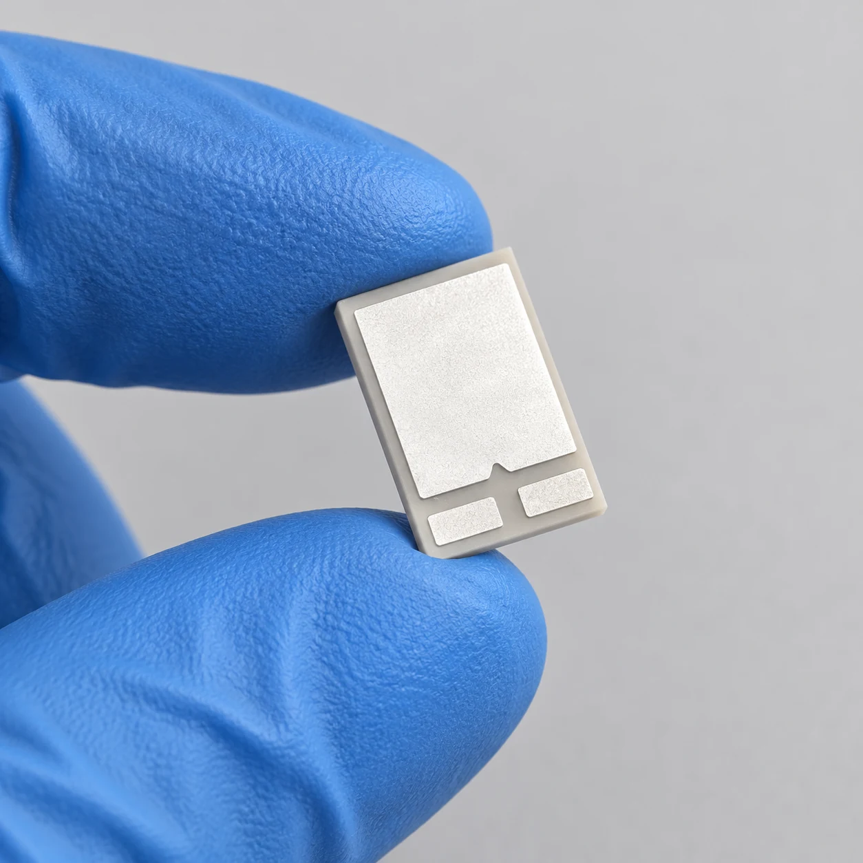 Aluminum nitride electronic ceramic components — hand-held view