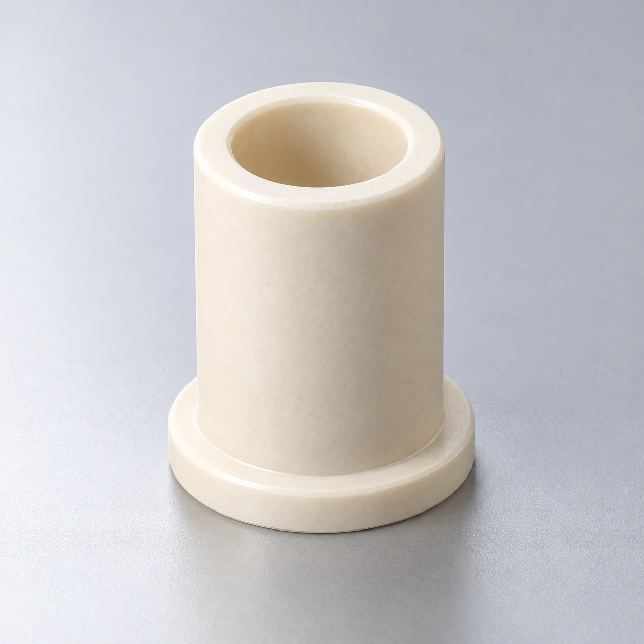 Close view of a ceramic guide bushing flange and open bore