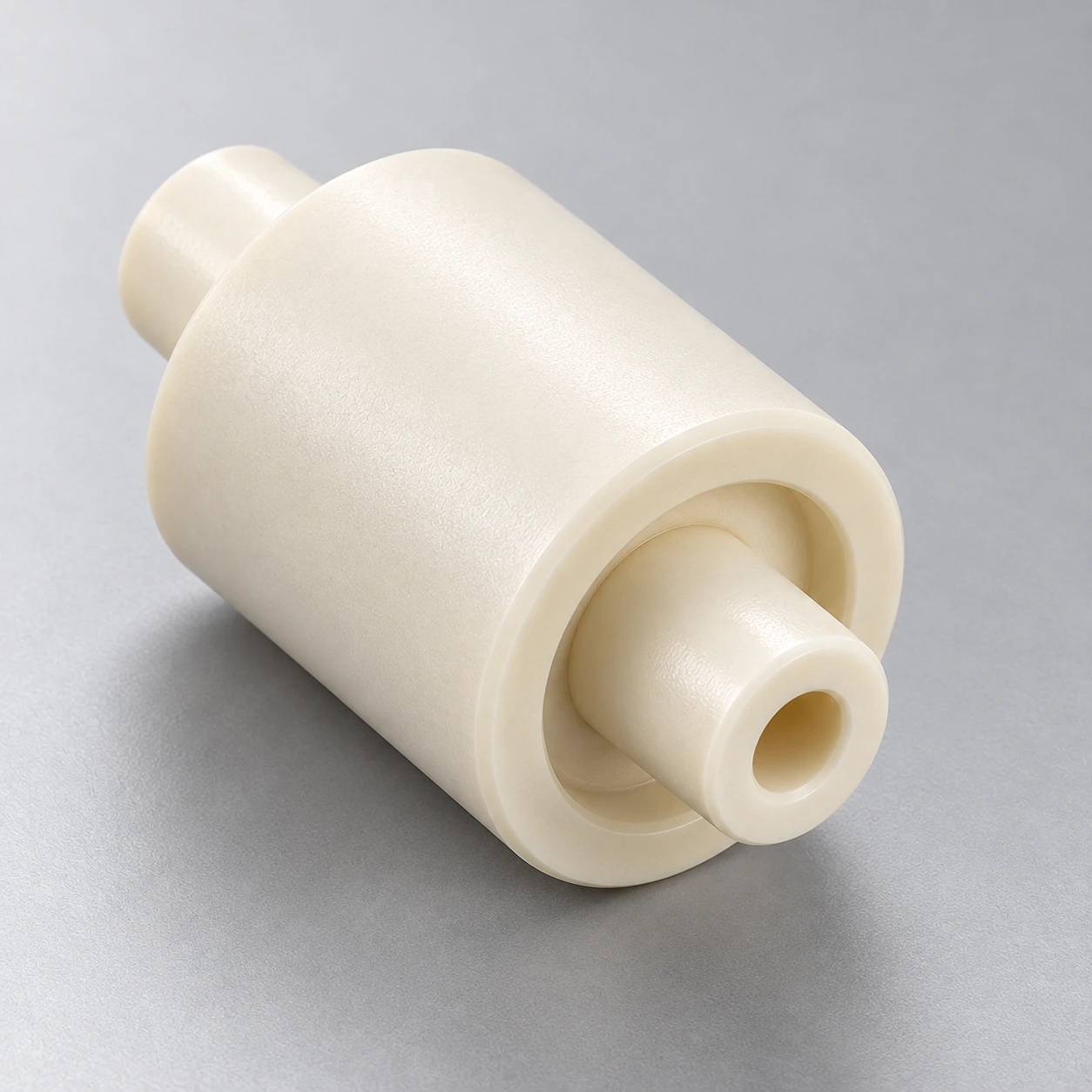 Close view of a coaxial stepped ceramic component and axial opening