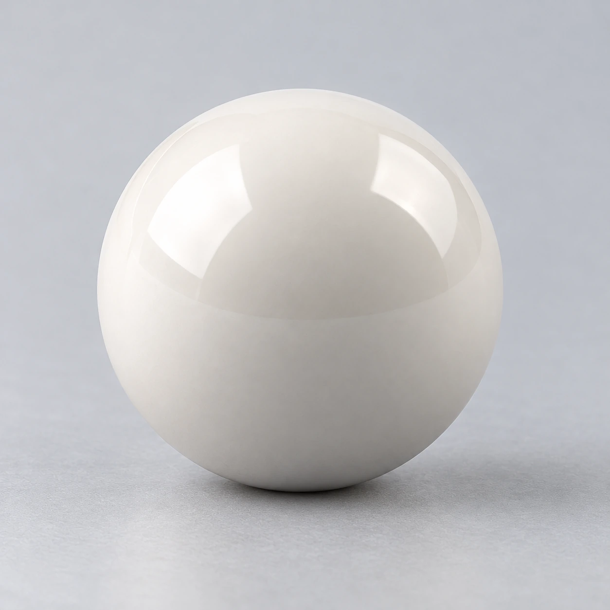 Close view of a polished white ceramic valve ball