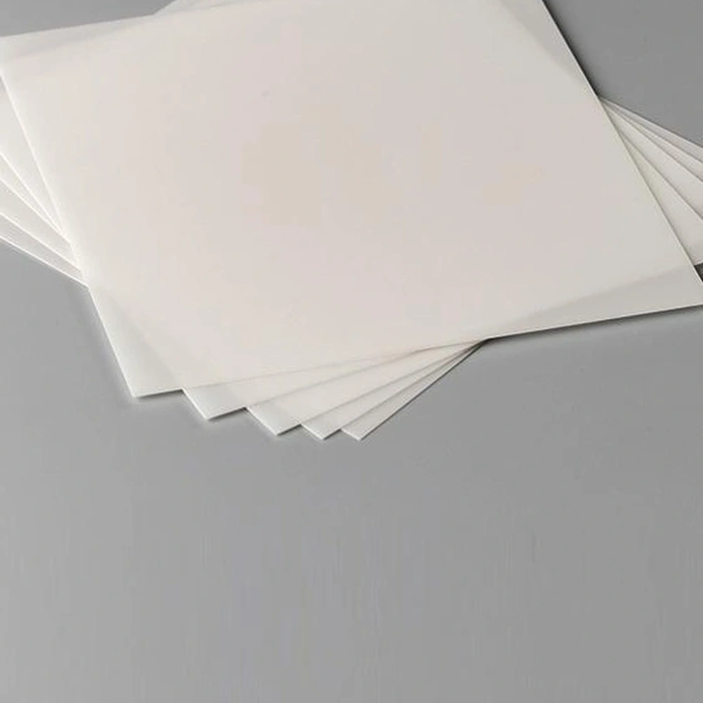 Detail view of alumina ceramic substrate sheets arranged in a thin stack