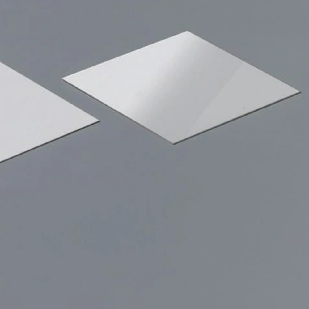 Detail view of alumina ceramic sheets showing contrasting surface reflections