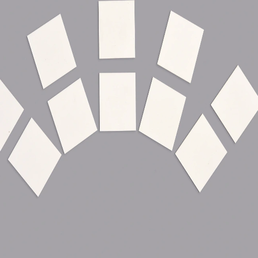Detail view of small bare alumina ceramic substrate blanks
