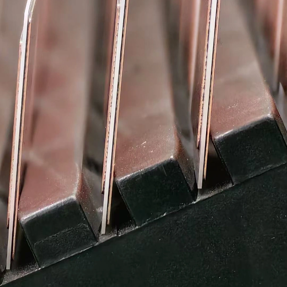 Copper and ceramic edge view of AMB panels in a production rack