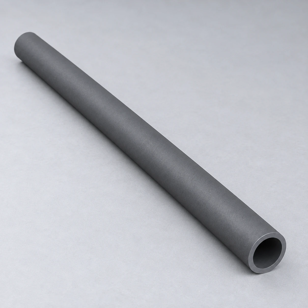 Independent conceptual longitudinal view of a straight silicon carbide tube with one visible open end