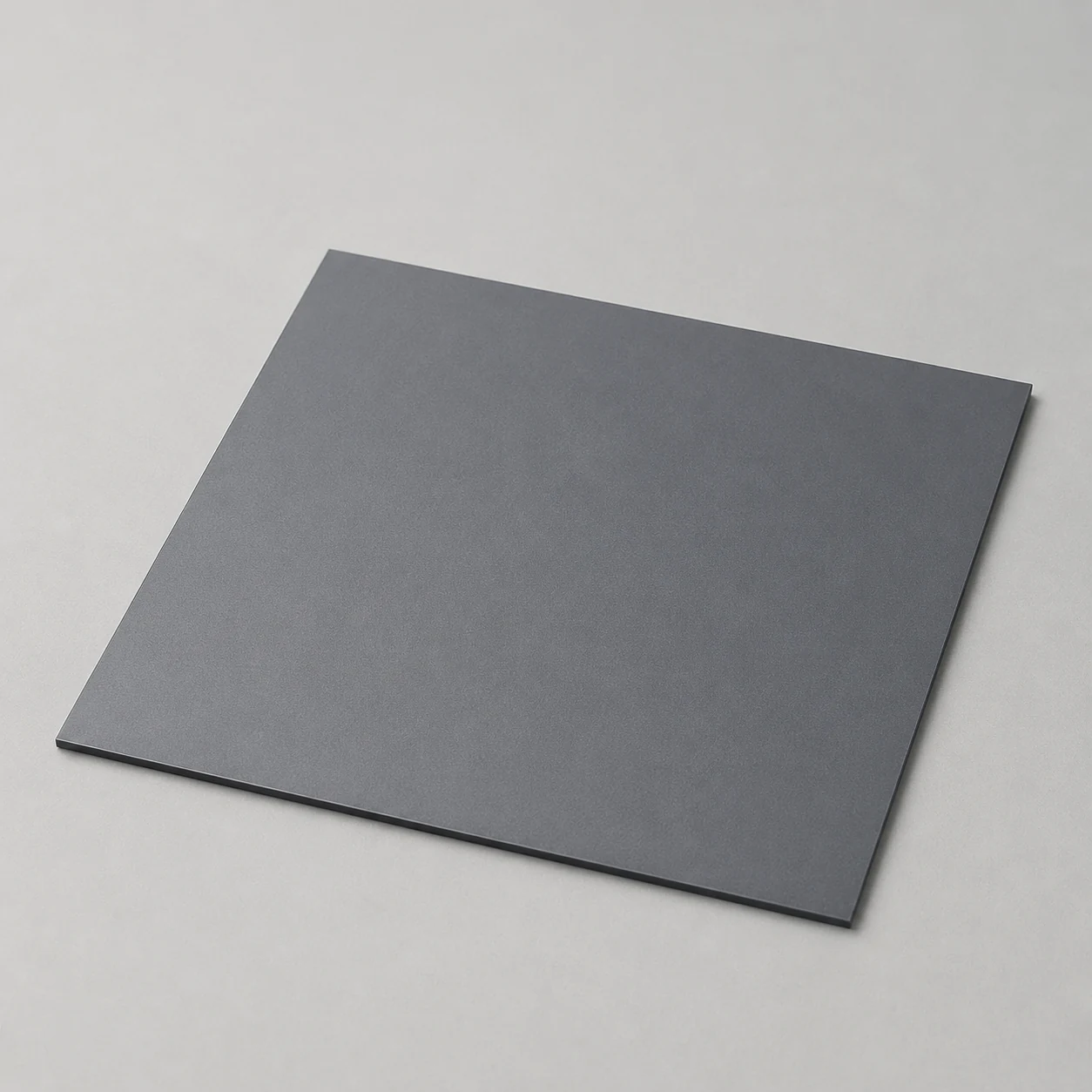 Single flat silicon nitride ceramic plate on a neutral industrial background