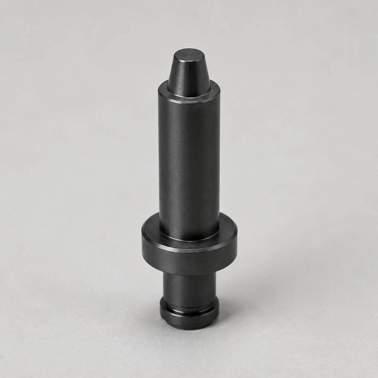 Silicon nitride positioning pin with stepped body, shoulder and tapered locating tip