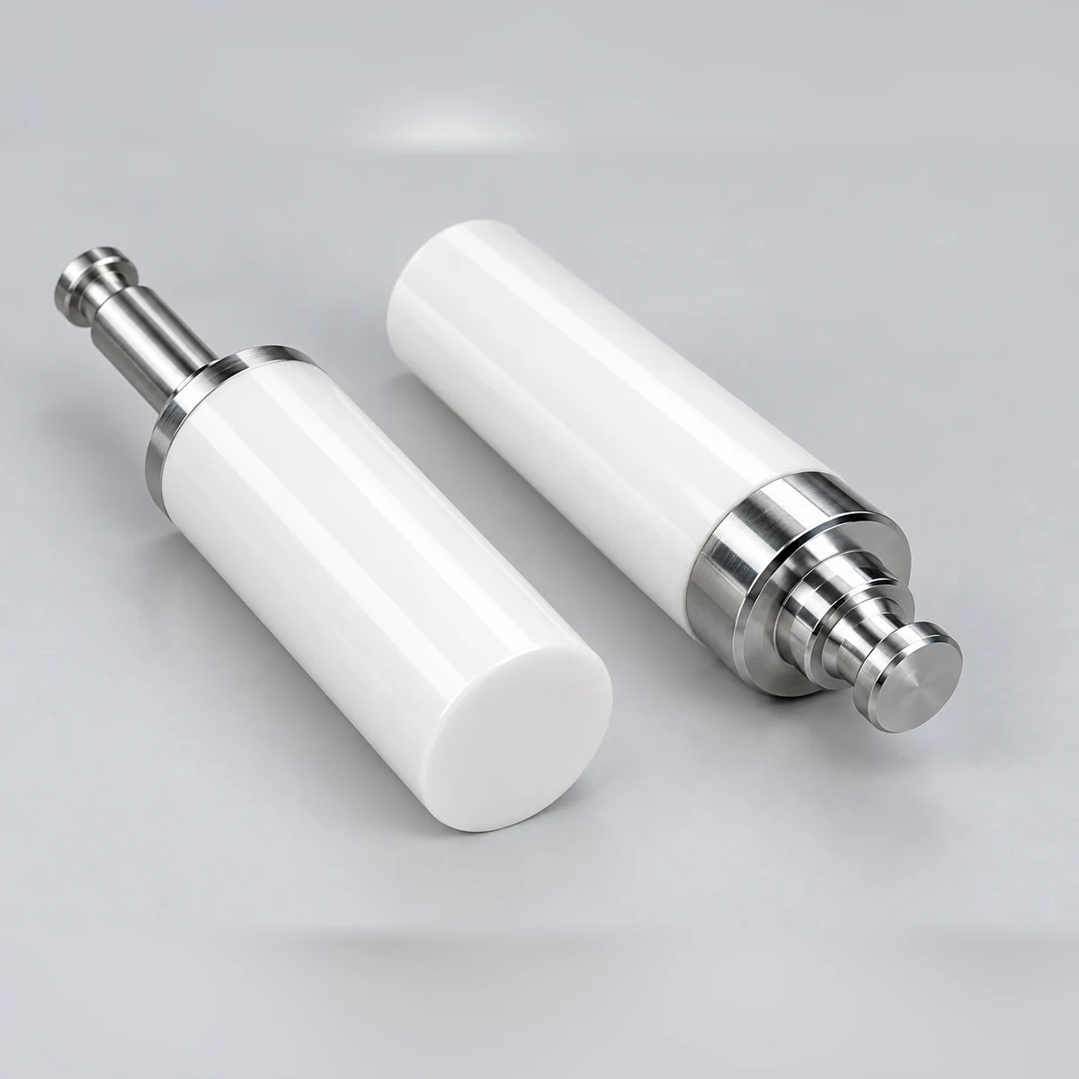 Two zirconia plungers with precision metal ends