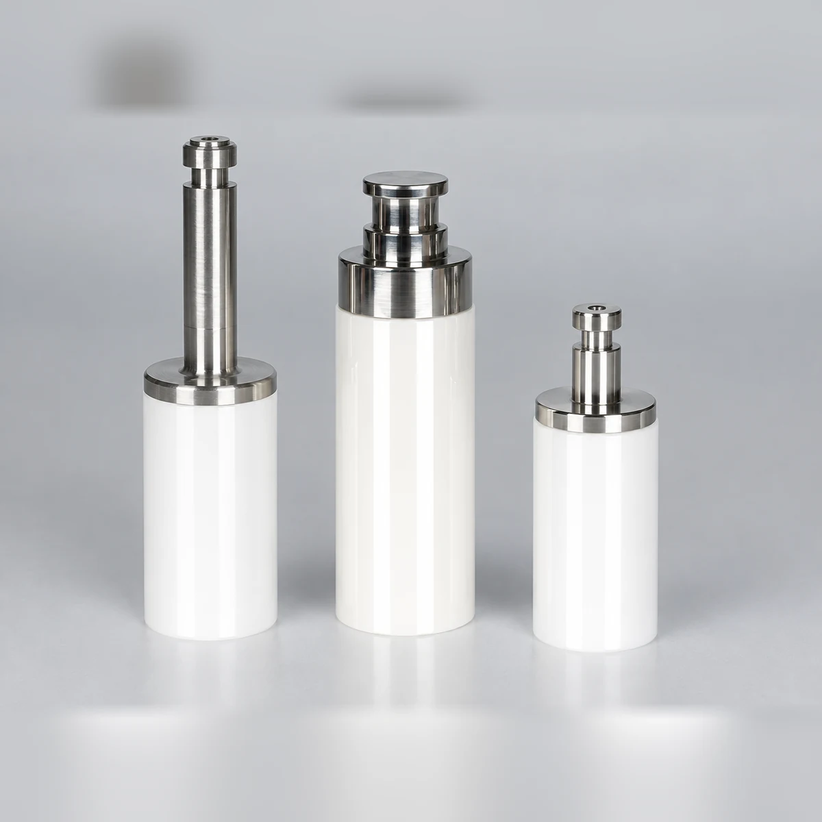 Three zirconia ceramic plungers with metal connection features