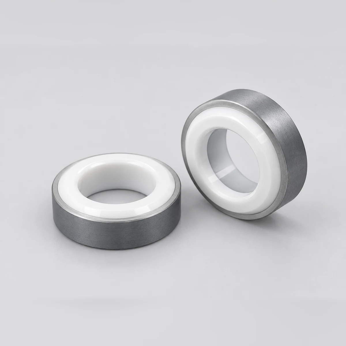 Two zirconia valve seats in face and angled views