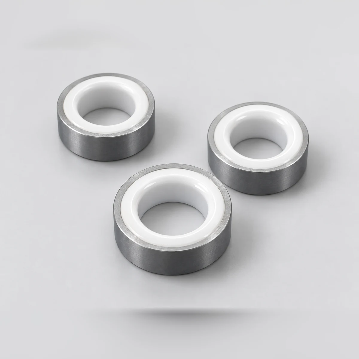 Three metal-supported zirconia valve seats